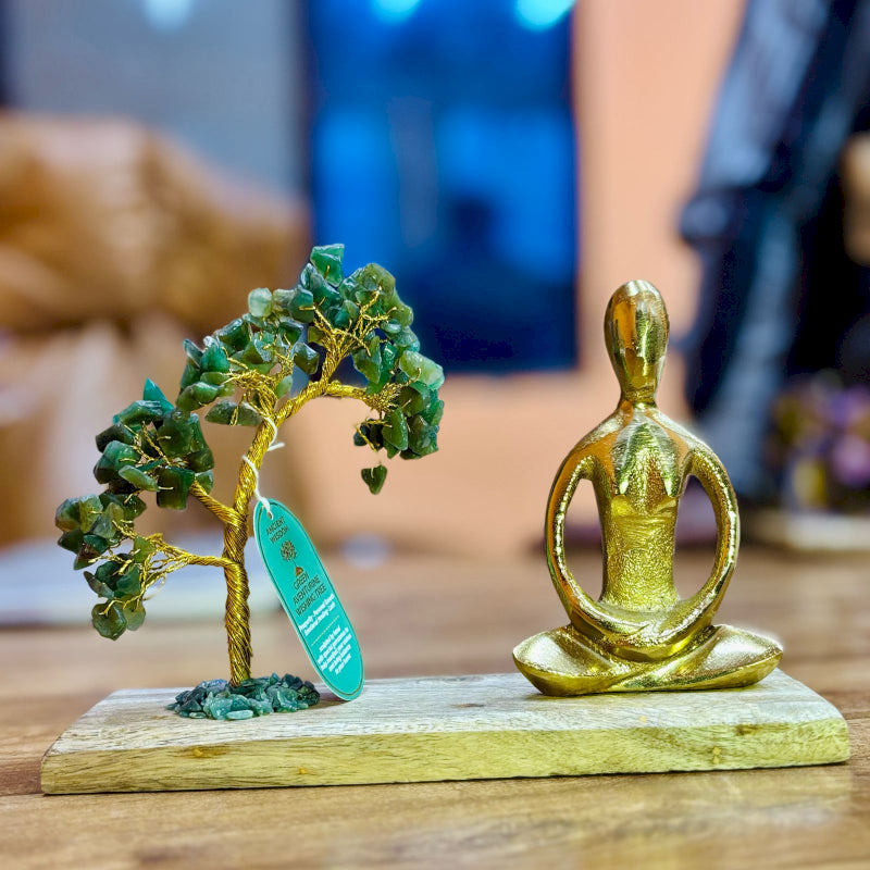 Green Aventurine Yoga Garden with gold statue doing Padmasana Pose