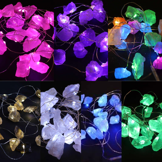 A collection of Gemstone Enchantment Rock Lights illuminated, showing all coloured crystals.