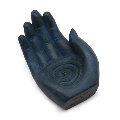 Blue hand-shaped incense burner with white background