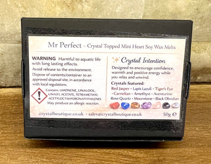 Box of Mr Perfect crystal topped mini heart soy wax melts with warning label on a wooden surface.