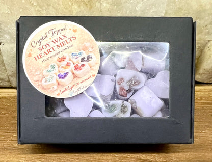 Box of crystal-topped soy wax melts with a decorative label on a wooden surface.