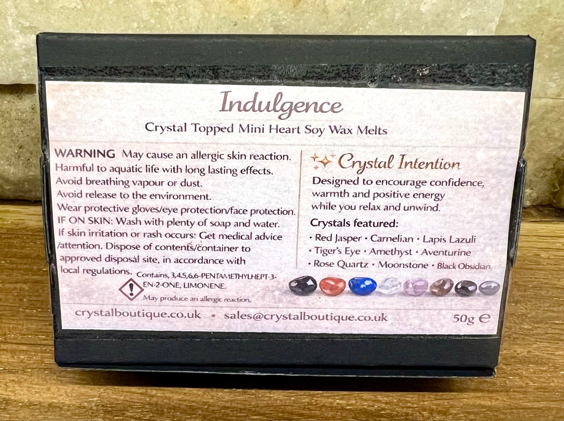 Box of Crystal Topped Mini Heart Soy Wax Melts with label on a wooden surface