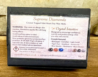 Box of Supreme Diamonds crystal-topped mini heart soy wax melts on a wooden surface.