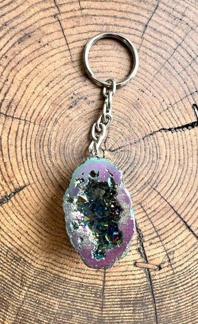 Rainbow aura quartz geode keyring on a silver-tone chain